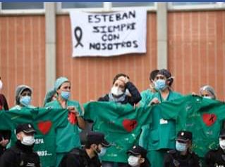 health-workers-console-wife-of-a-male-nurse-that-died-of-coronavirus-in-spain-esteban-Severo-Ochoa-Hospital-in-Leganes-near-Madrid-April-10-Spain2-JPG